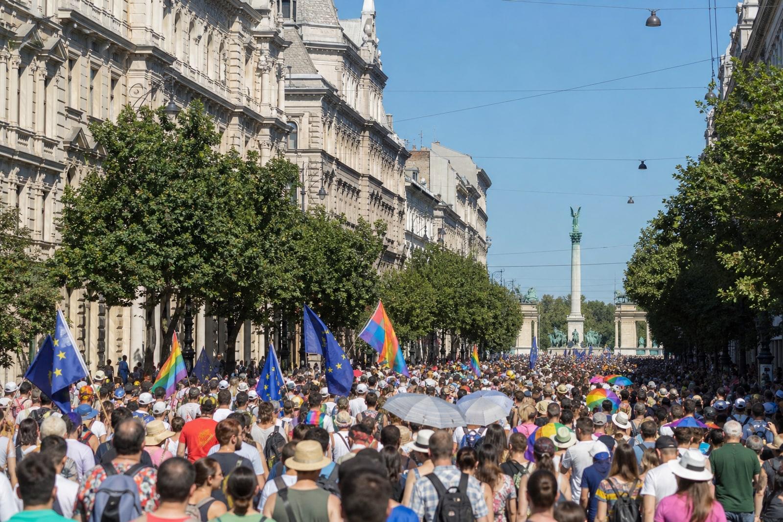 Crowds with rainbow and EU flags fill Budapest's Andrássy Avenue during the 2026 Pride march (AI-generated illustration).