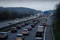 Commuter traffic on the A31 motorway approaching the Luxembourg border at dawn