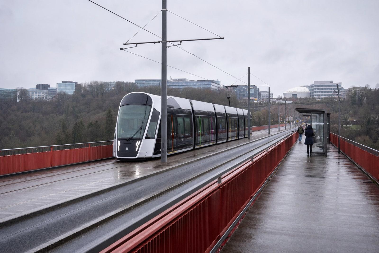 A tram crossing the Pont Grande-Duchesse Charlotte in Luxembourg City on an overcast morning