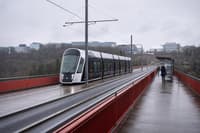 A tram crossing the Pont Grande-Duchesse Charlotte in Luxembourg City on an overcast morning