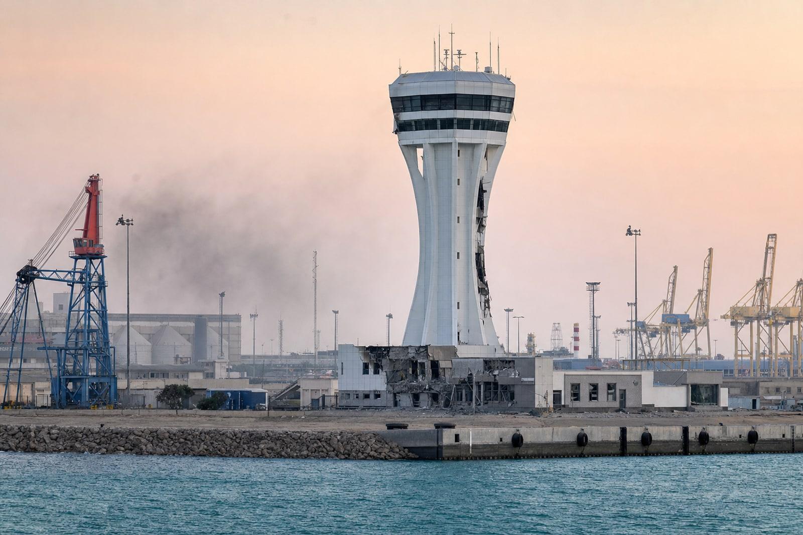 Damaged maritime traffic-control tower overlooking the piers and breakwater at Chabahar Port in Iran.