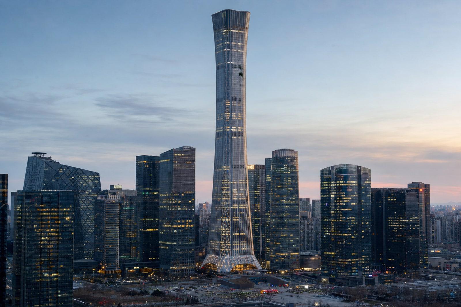 Illustration of Beijing's tapering CITIC Tower (China Zun) skyscraper at dusk with localised damage to an upper floor and an emergency cordon below.