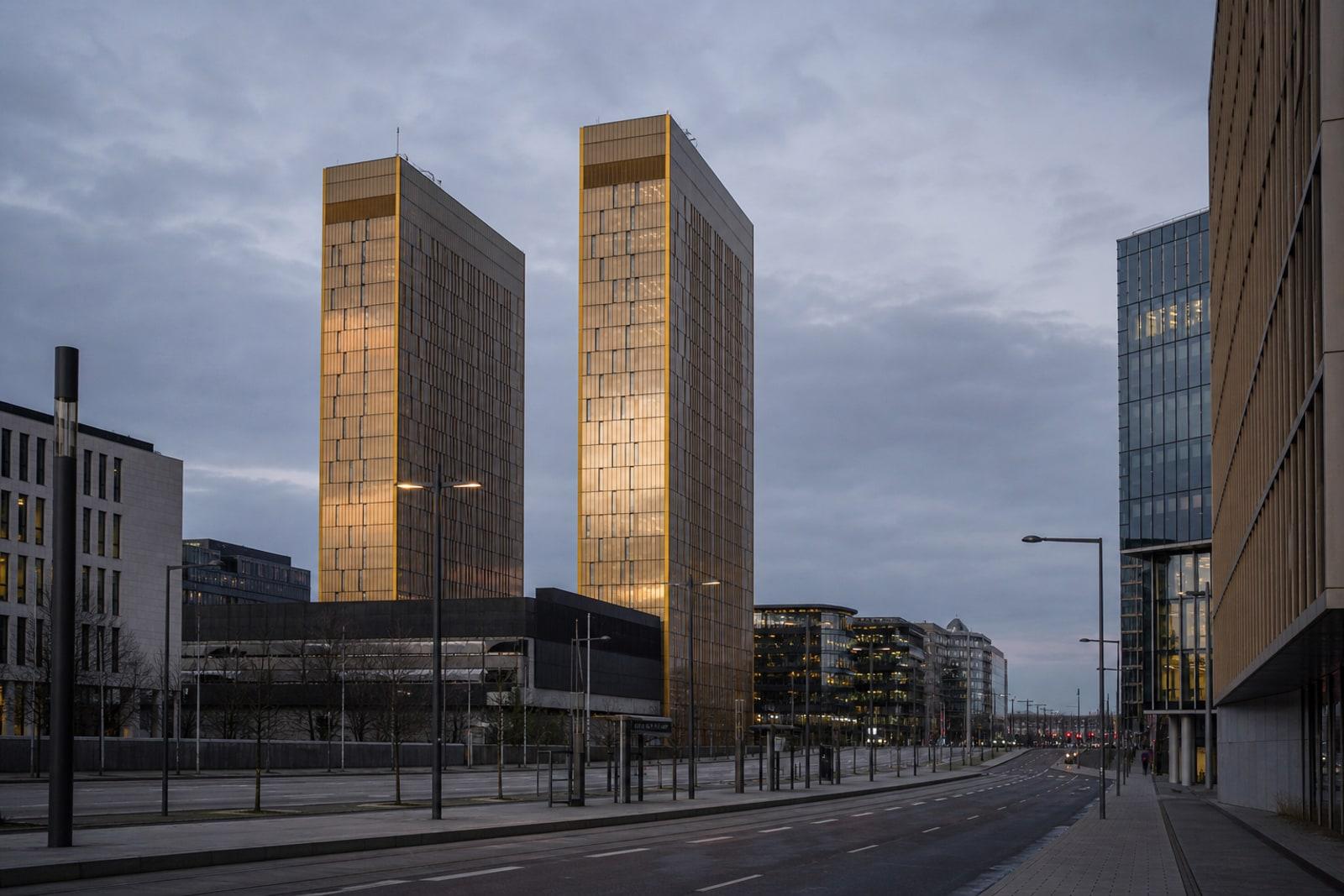 The golden Porte de l'Europe towers and office buildings of Luxembourg City's Kirchberg financial district at dusk
