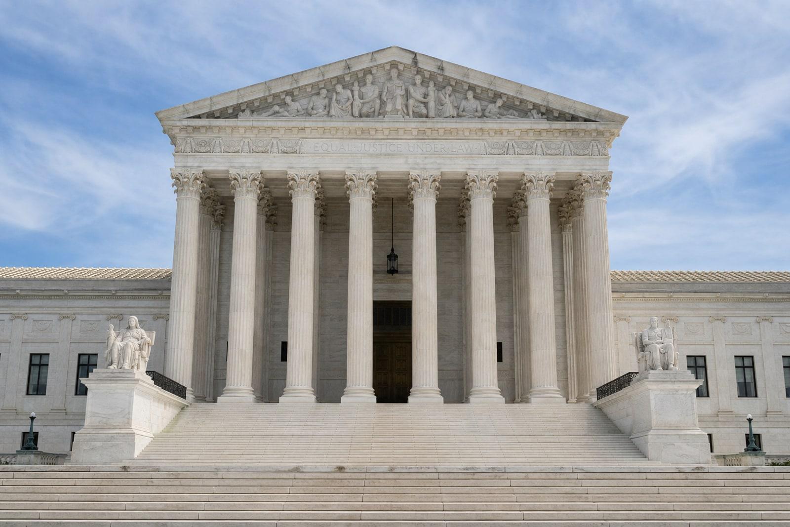 The white marble west façade and Corinthian columns of the United States Supreme Court Building in Washington, D.C.